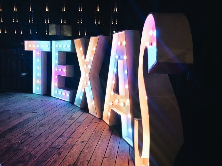 Lighted sign that spells TEXAS.
