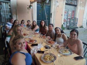 Group of Study Abroad students enjoying their fresh pasta