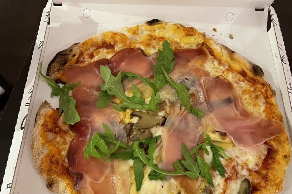 Prosciutto Pizza topped with Arugula from Pepys