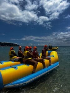 A photo of a group of people on a Banana Boat in the water of Costa Brava.