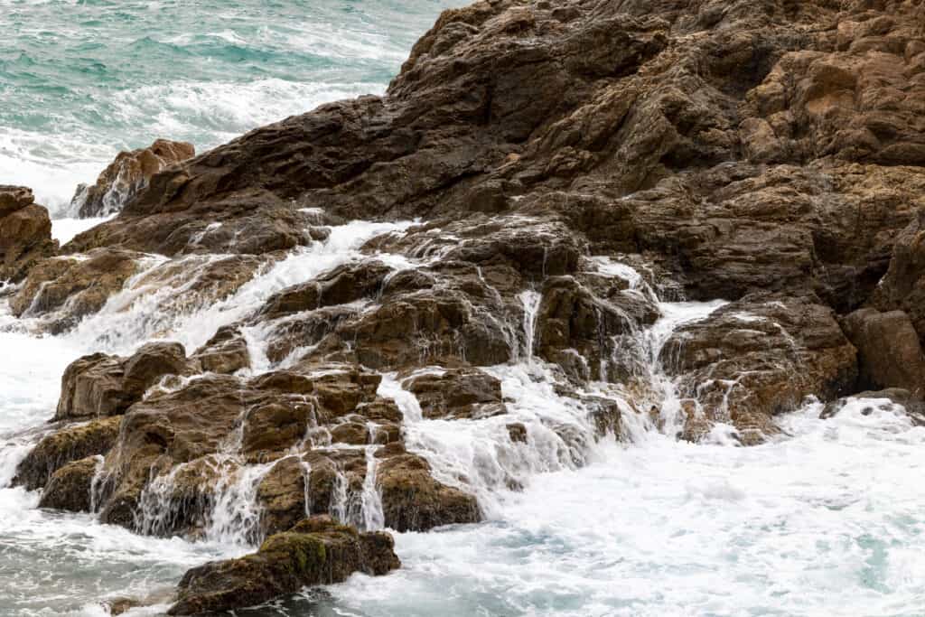 Water rushing over rocks in Tossa De Mar, Spain