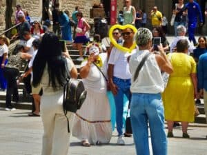 Barcelona Cathedral clown poses with unknowing tourist.