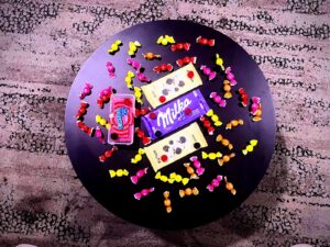 An image of various Spanish candies on a round table.