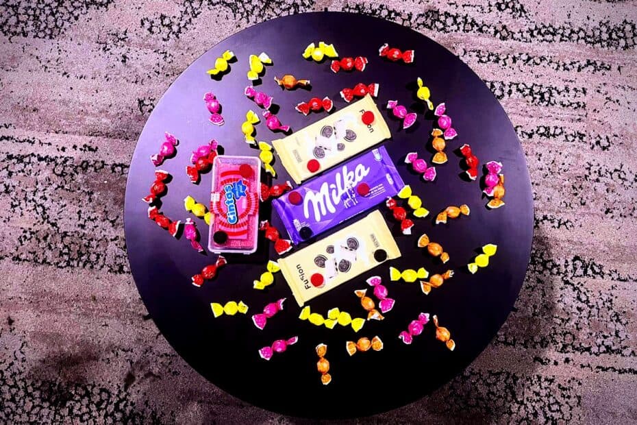 An image of various Spanish candies on a round table.