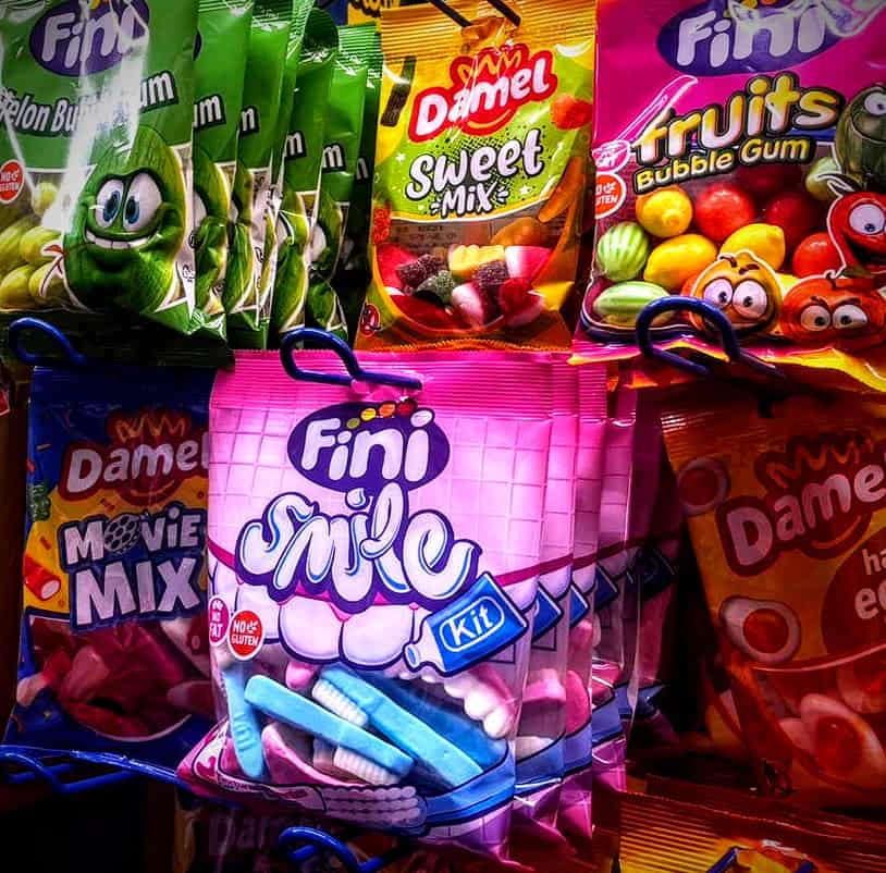 An image of bags of candy in a grocery store.