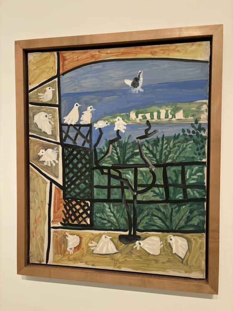 A Picasso painting of an abstract window-like structure with white pigeons sitting on the sill, and outside on a black gate