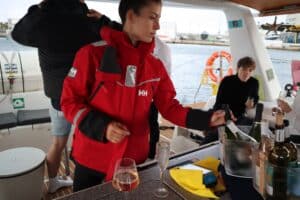 This was one of the crew onboard the boat pouring us up some drinks. As you can see she has a super big coat on and in the background it is apparent that the weather was terrible.