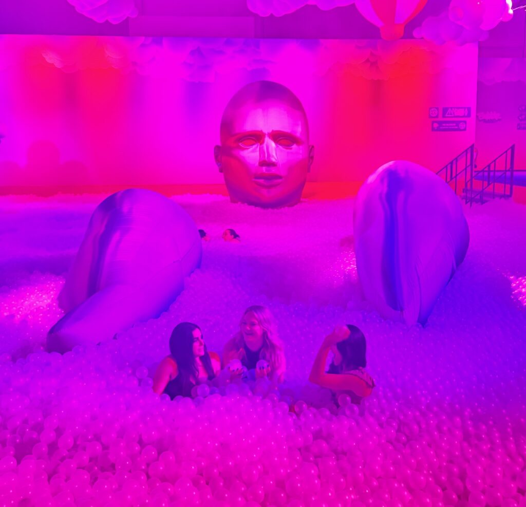 three girls playing in bubble bath pit at bubble planet.