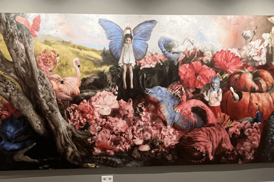 A Guillermo Lorca painting depicting a dreamlike world with two little girls, butterflies, flowers, pumpkins, and tigers.