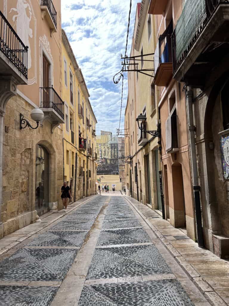 View of Tarragona Street and building structures.