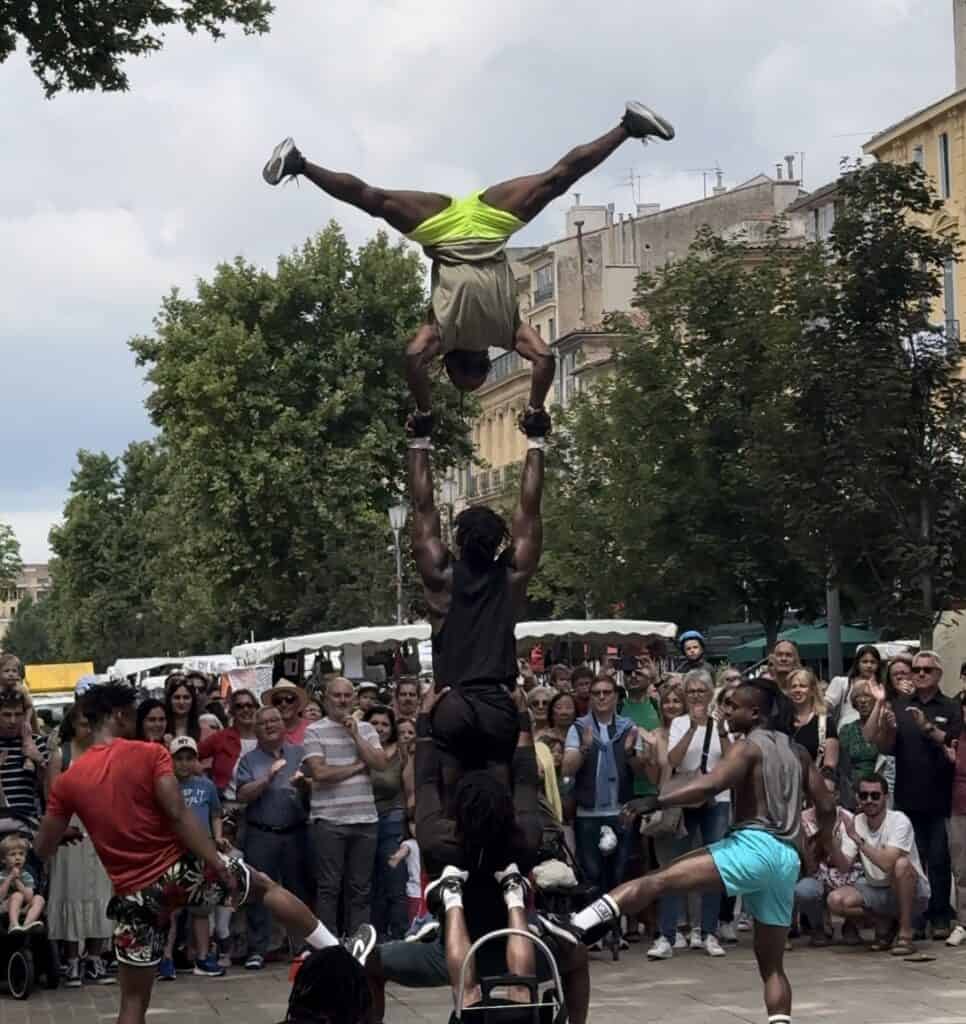 Street dancers doing a handstand.