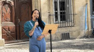 A performer singing her own rendition of an Amy Winehouse song