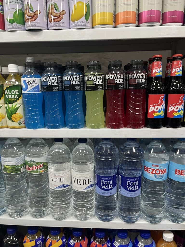 A shelf of drinks at a grocery store in Barcelona