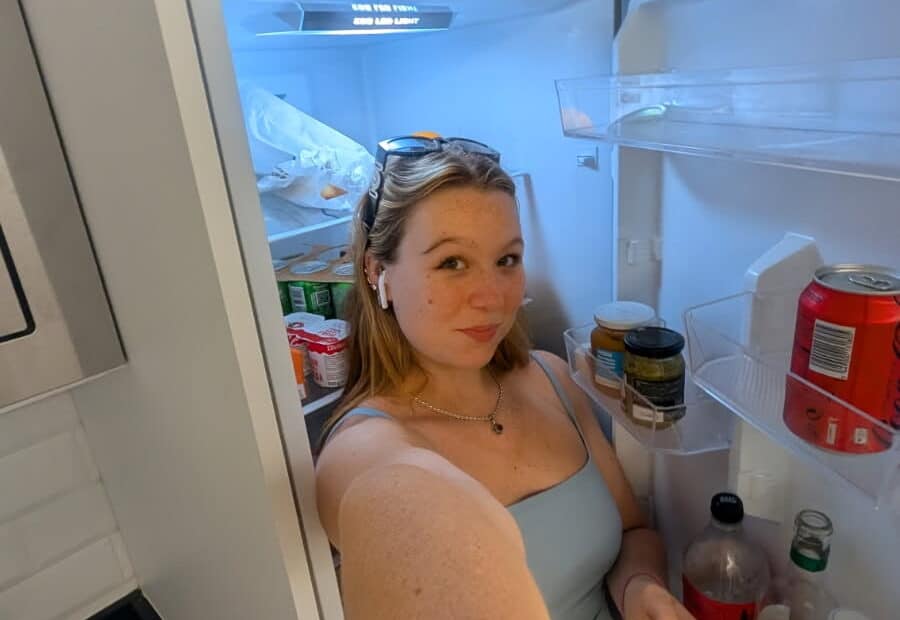 Girl standing in front of the fridge