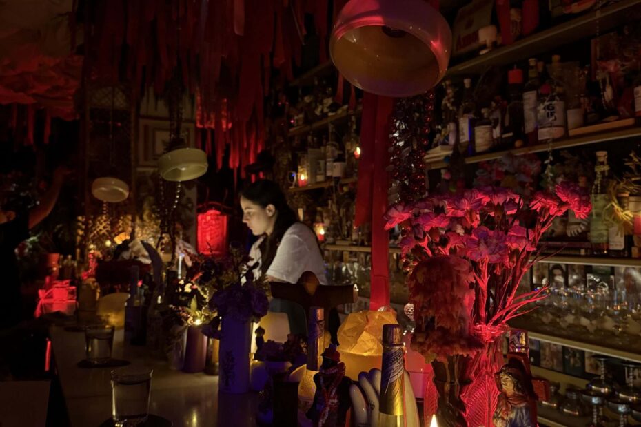 Image of a bartender crafting a drink in a dimly lit bar.