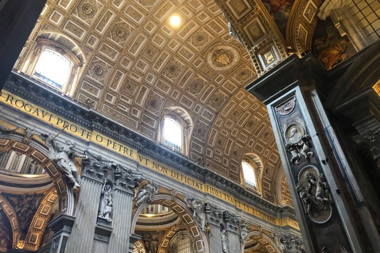 The ceiling of St. Peter's Basilica features original Roman writing.