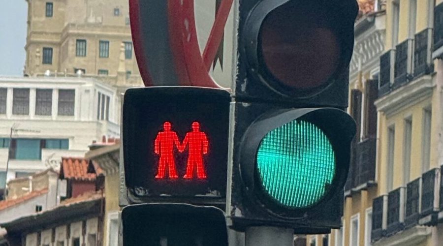 thumbnail_IMG_0766 A photo of a red crosswalk sign featuring two masculine figures holding hands.
